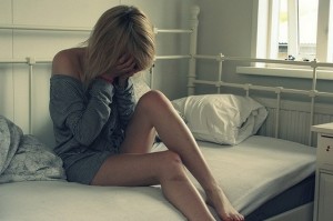 361298283-sad-alone-crying-girl-on-bed